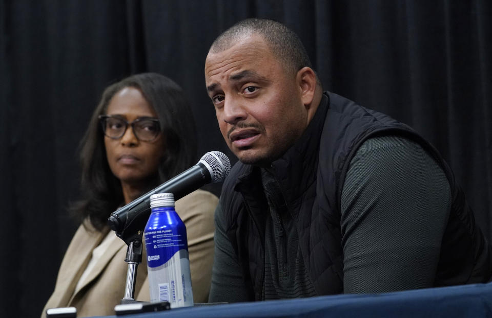 University of Virginia Athletic Directer Carla Williams, left, and head football coach, Tony Elliott, right, speak to the media during a press conference concerning the killing of three football players as well as the wounding of two others at the University of Virginia Tuesday Nov. 15, 2022, in Charlottesville. Va. Authorities say three people have been killed and two others were wounded in a shooting at the University of Virginia and a student suspect is in custody. (AP Photo/Steve Helber)