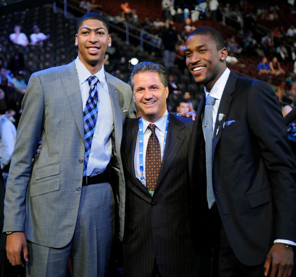 Kentucky head coach John Calipari, center, stands with former players Anthony Davis, left, and Michael Kidd-Gilchrist, right, before the 2012 NBA basketball draft. Davis was selected the No. 1 overall pick by the New Orleans Hornets, and Kidd-Gilchrist was selected No. 2 by the Charlotte Bobcats.