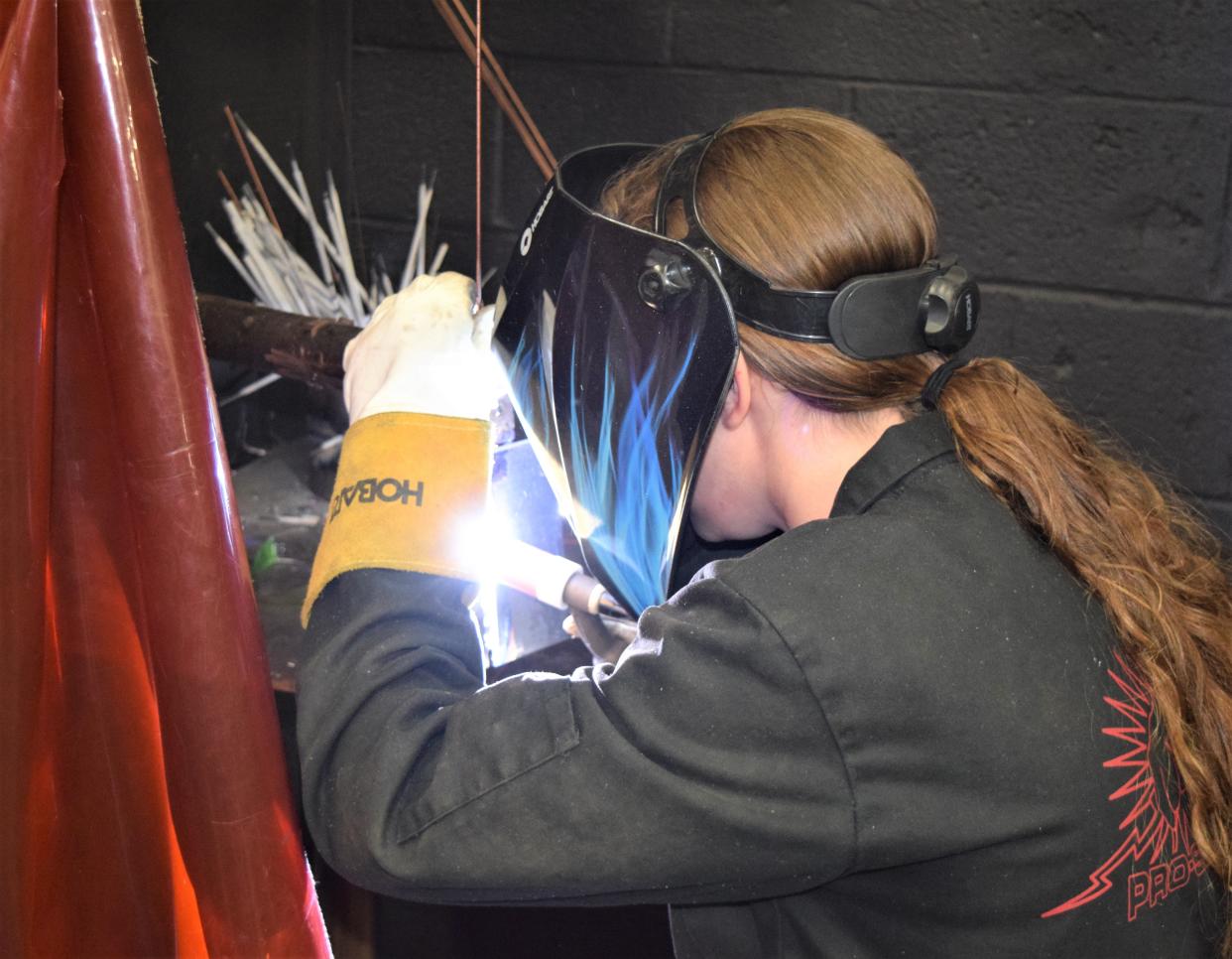 Erica Calame works on a welding project during RAMTEC class at Ashland County West Holmes Career Center.