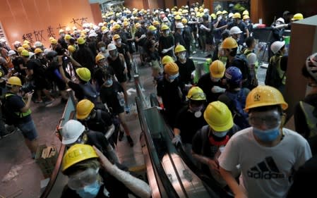 Protesters break into the Legislative Council building during the anniversary of Hong Kong's handover to China in Hong Kong