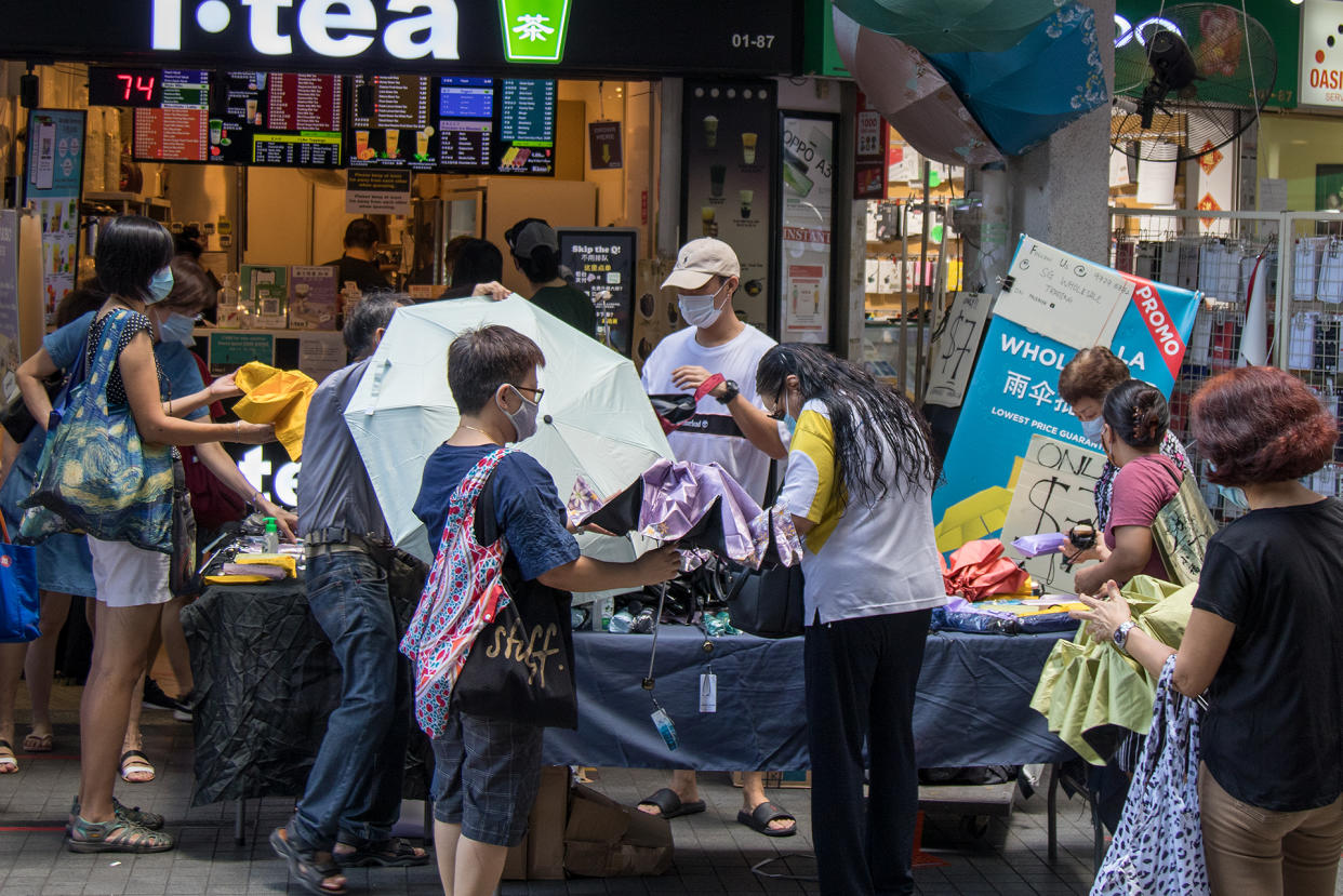 A vendor selling umbrellas seen at the Clementi Town Centre on 19 June 2020. (PHOTO: Dhany Osman / Yahoo News Singapore)