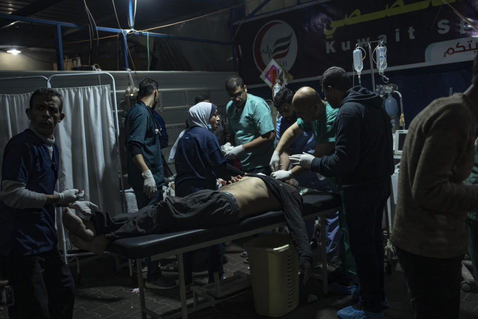 A Palestinian wounded in the Israeli bombardment of the Gaza Strip arrives at a hospital in Rafah on Wednesday, Dec.13, 2023. (AP Photo/Fatima Shbair)