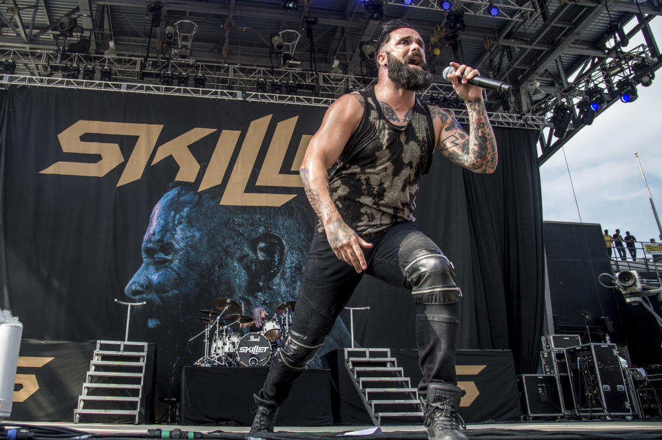 FILE - In this May 20, 2017 file photo, John Cooper of Skillet performs at Rock On The Range Music Festival in Columbus, Ohio. More and more performers are changing live concerts plans because of the new coronavirus, which has forced Mariah Carey, BTS, Pearl Jam and even the Coachella festival to postpone dates. Skillet is performing the last several dates on their current tour, with shows in New York and Virginia taking place this week. Despite the spread of the virus, Cooper said he and his bandmates are still holding meet-and-greets with concertgoers. (Photo by Amy Harris/Invision/AP, File)