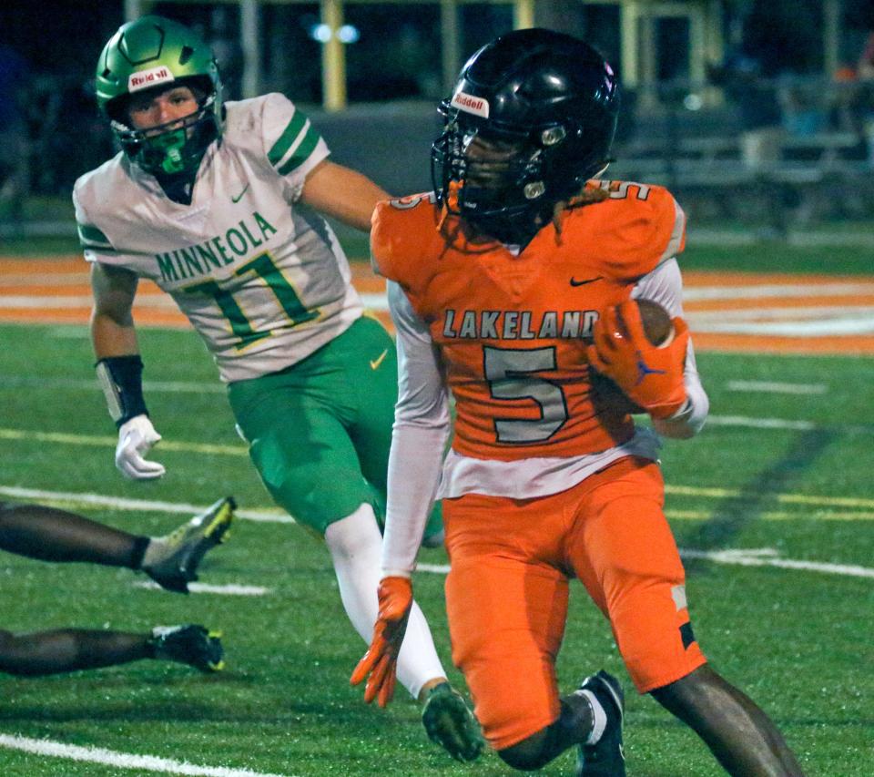 Lakeland's Brayshon Williams returns a kickoff against Lake Minneola on Thursday night at Bryant Stadium.