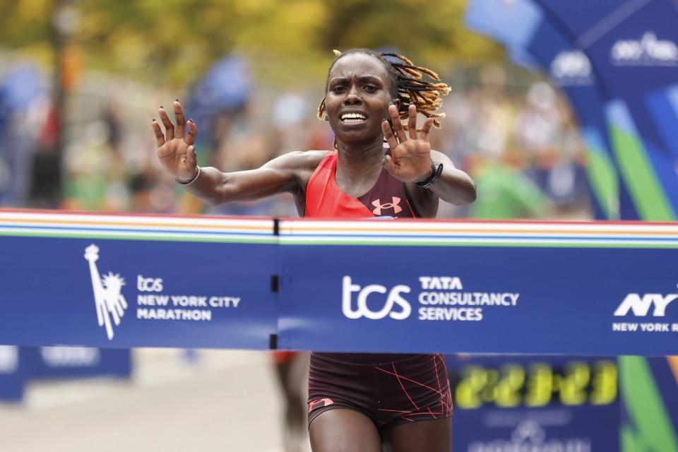 Mandatory Credit: Photo by Jason DeCrow/AP/Shutterstock (13610921m) Sharon Lokedi, of Kenya, crosses the finish line first in the women's division of the New York City Marathon, in New York NYC Marathon, New York, United States - 06 Nov 2022