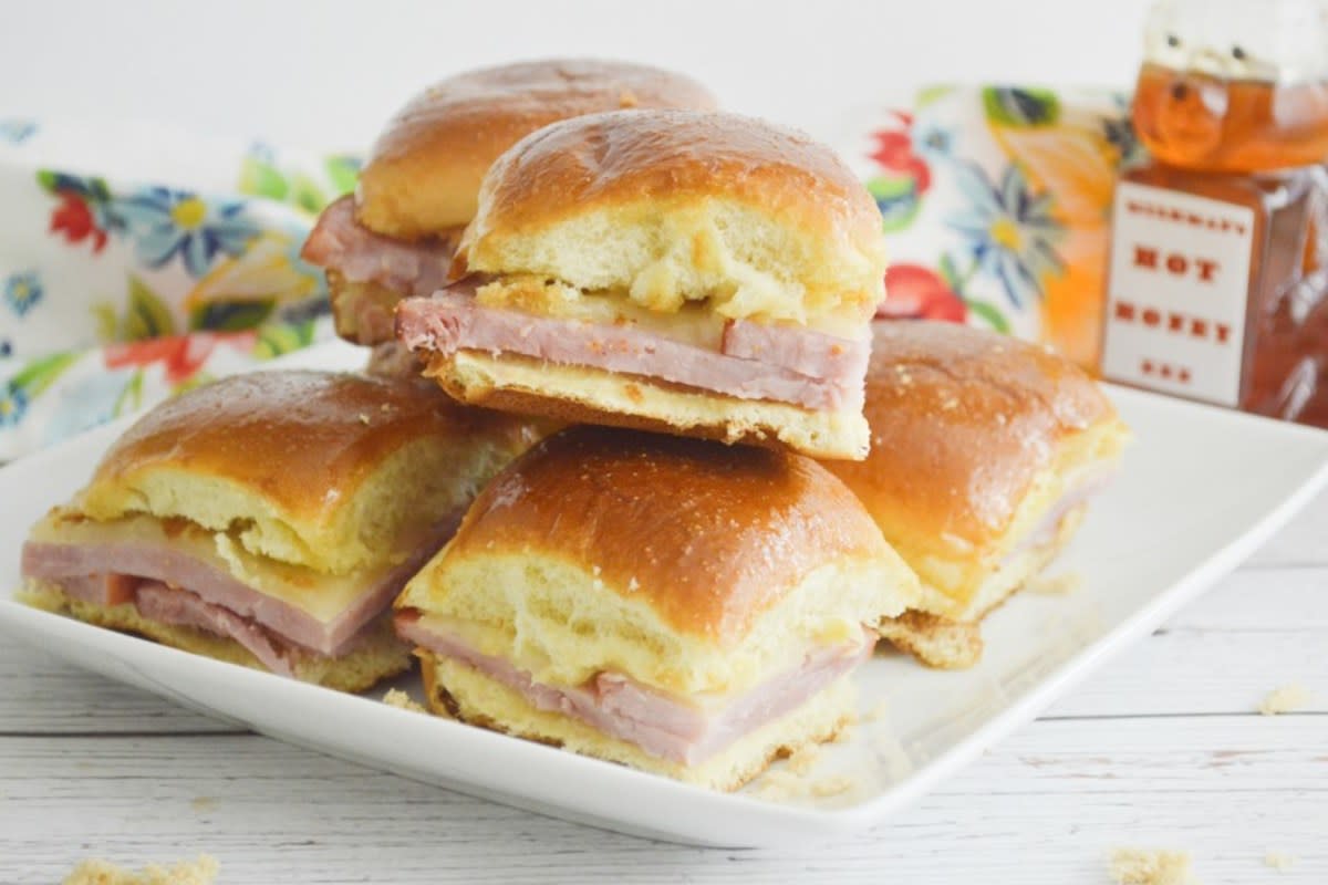 <p>Stef's Eats and Sweets</p><p>Classic ham and cheese gets a welcomed new flavor profile in these spicy little sliders.</p><p><strong>Get the recipe: <a href="https://stefseatsandsweets.com/hot-honey-ham-swiss-sliders" rel="nofollow noopener" target="_blank" data-ylk="slk:Hot Honey Ham & Swiss Sliders;elm:context_link;itc:0;sec:content-canvas" class="link rapid-noclick-resp">Hot Honey Ham & Swiss Sliders</a></strong></p>