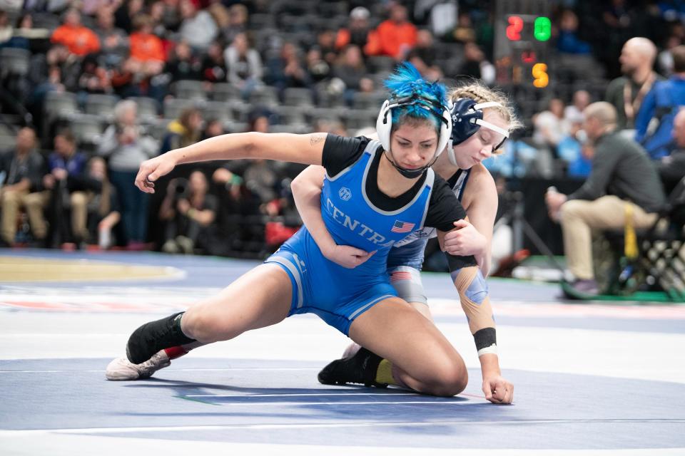 Pueblo Central's Roxie Rodriguez works to escape Faith Vondy of Severance during their 125-pound first round matchup in the girls wrestling state tournament at Ball Arena on Thursday, Feb. 16, 2023.