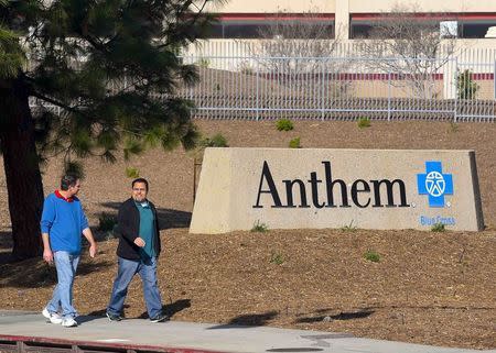 People walk past the office building of health insurer Anthem in Los Angeles, California February 5, 2015. REUTERS/Gus Ruelas