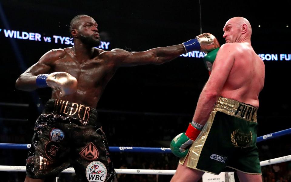 Deontay Wilder in action against Tyson Fury  - Reuters