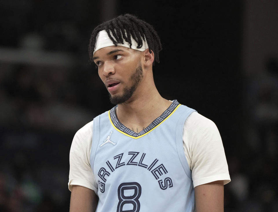 FILE - Memphis Grizzlies' Ziaire Williams looks on during an NBA basketball game against Golden State Warriors, March 28, 2022, in Memphis, Tenn. Williams used a disposable camera from the podium and asked everyone to smile during the Grizzlies' Media Day, Monday, Sept. 26, 2022. (AP Photo/Karen Pulfer Focht, File)