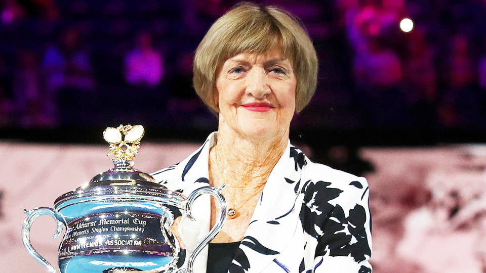 Margaret Court (pictured) holding up the Australian Open trophy.