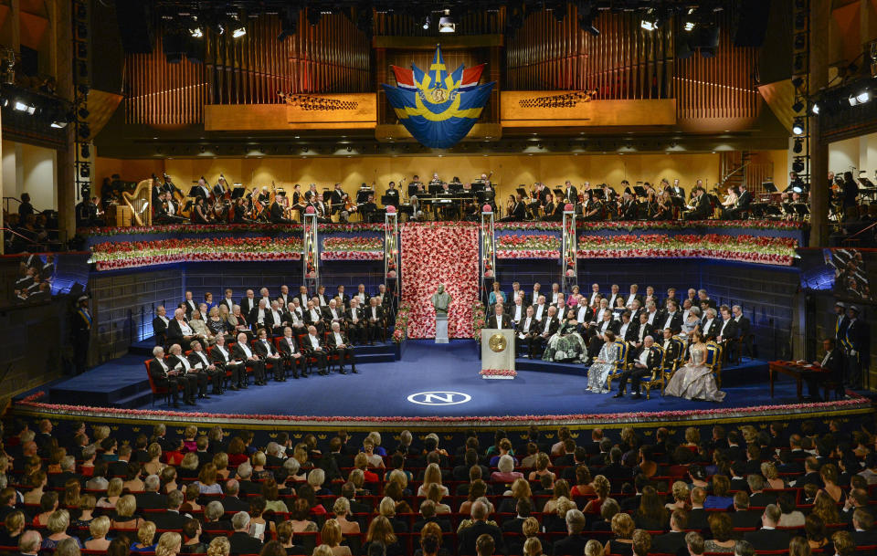 FILE - The ten 2016 Nobel laureates in literature, medicine, chemistry, physics and economics are seated, front row left, across from King Carl XVI Gustaf of Sweden and the royal family during the 2016 Nobel prize award ceremony at the Stockholm Concert Hall on Saturday Dec. 10, 2016. This year’s Nobel season approaches as Russia’s invasion of Ukraine has shattered decades of almost uninterrupted peace in Europe and raised the risks of a nuclear disaster. The famously secretive Nobel Committee never leaks or hints who will win its prizes for medicine, physics, chemistry, literature, economics or peace. So it is anyone’s guess who might win the awards that will be announced starting next Monday, Oct. 3, 2022. (Jessica Gow/TT News Agency via AP, File)/TT News Agency via AP)