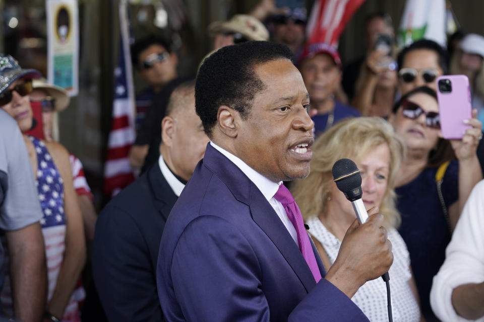 FILE - In this July 13, 2021, file photo, conservative radio talk show host Larry Elder speaks to supporters during a campaign stop in Norwalk, Calif. Elder was not on the list of candidates released Saturday in the recall election that could end the term of California Gov. Gavin Newsom. (AP Photo/Marcio Jose Sanchez, File)