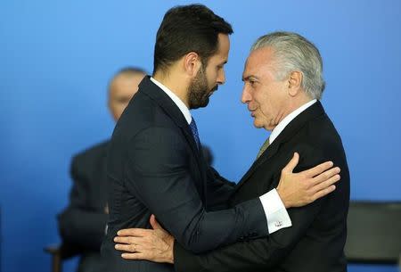 Brazil's interim President Michel Temer greets the new Minister of Culture, Marcelo Calero, during a ceremony at the Planalto Palace in Brasilia, Brazil, May 24, 2016. REUTERS/Adriano Machado