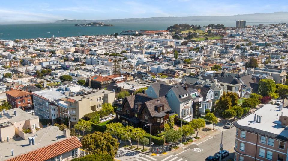 A historic home in San Francisco, California, designed as an anti-Victorian residence built in 1899, is for sale, with Golden Gate Bridge.