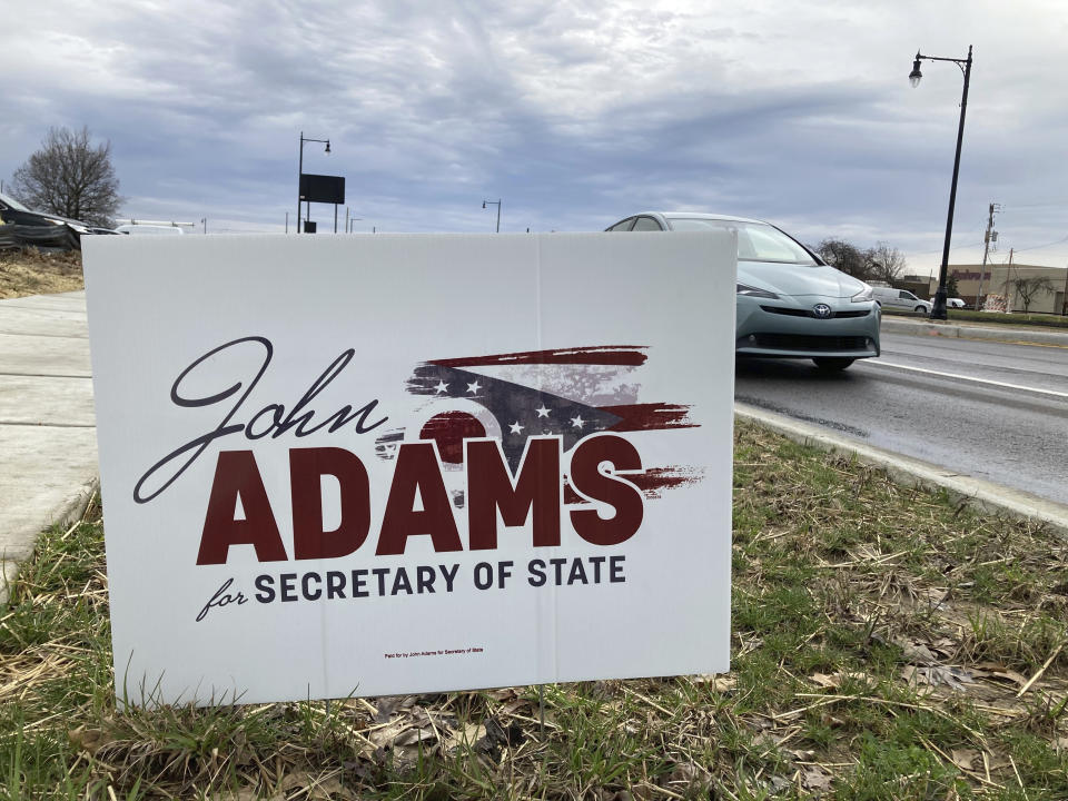 FILE - A campaign sign stands outside JD's Place in Worthington, Ohio, where Republican Secretary of State candidate John Adams, a former state lawmaker and Navy SEAL, spoke to members of the Worthington Area Republican Club, March 22, 2022. Former President Donald Trump's attempts to reverse the results of the 2020 election and his subsequent endorsements of candidates for state election offices who are sympathetic to his view have elevated those races to top-tier status. (AP Photo/Julie Carr Smyth, File)