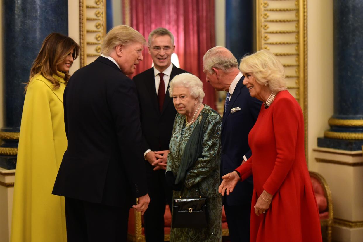 Britain's Queen Elizabeth II (3rd R) speaks with NATO Secretary General Jens Stoltenberg (3rd L), US First Lady Melania Trump (L) and US President Donald Trump (2nd L), Britain's Camilla, Duchess of Cornwall (R) and Britain's Prince Charles, Prince of Wales (2nd R) in Buckingham Palace in central London on December 3, 2019, during a reception hosted by Britain's Queen Elizabeth II ahead of the NATO alliance summit. - NATO leaders gather Tuesday for a summit to mark the alliance's 70th anniversary but with leaders feuding and name-calling over money and strategy, the mood is far from festive. (Photo by Geoff PUGH / POOL / AFP) (Photo by GEOFF PUGH/POOL/AFP via Getty Images)