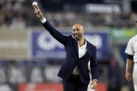 CORRECTS THAT JETER WAS INDUCTED IN 2021, NOT THIS YEAR - Baseball Hall of Famer Derek Jeter throws out a ceremonial first pitch after he was honored for his induction into the hall in 2021, before a baseball game between the Tampa Bay Rays and the New York Yankees on Friday, Sept. 9, 2022, in New York. (AP Photo/Adam Hunger)