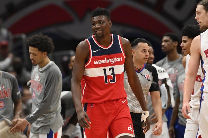 Washington Wizards center Thomas Bryant (13) reacts during the second half of an NBA basketball game against the Detroit Pistons, Tuesday, March 1, 2022, in Washington. The Wizards won 116-113. (AP Photo/Nick Wass)