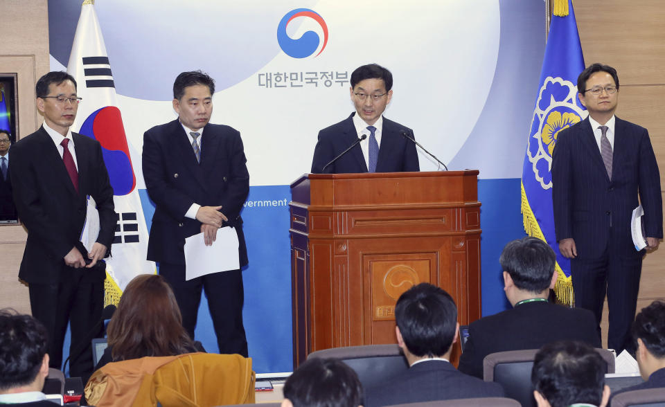 Yoon Chang-yul, second from right, a senior official at the Prime Minister's Office, announces the government's stance on the World Trade Organization's ruling in favor of South Korea 's import ban on Japanese seafood at the government complex in Sejong, South Korea, Friday, April 12, 2019. South Korea on Friday welcomed the decision and said it will continue to block all fishery products from Fukushima and seven neighboring prefectures to ensure "only foods that are confirmed as safe are put on the table. (Jin Sung-chul/Yonhap via AP)