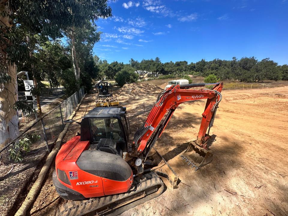 Heavy equipment used to excavate portions of St. Thomas Aquinas Cemetery near Ojai stands idle on Sept. 8.