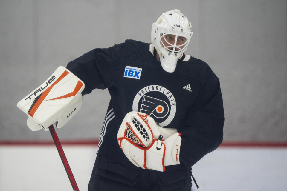 Philadelphia Flyers' Ivan Fedotov takes to the ice for some NHL hockey practice following his introductory press conference, Friday, March 29, 2024, in Voorhees, N.J. (AP Photo/Chris Szagola)