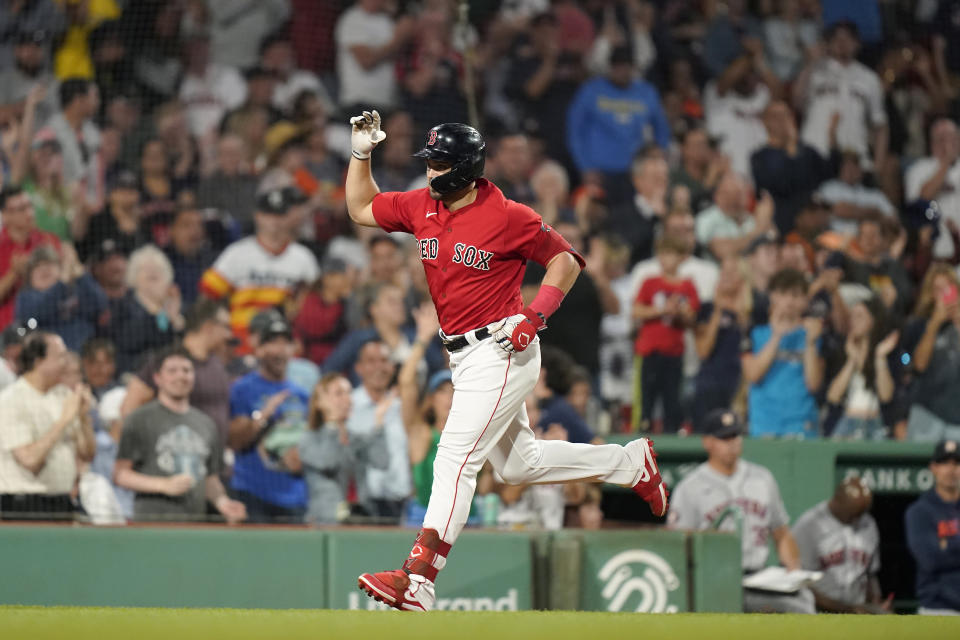 Boston Red Sox's Adam Duvall celebrates as he runs the bases toward home to score on a two-run home run in the fifth inning of a baseball game against the Houston Astros, Monday, Aug. 28, 2023, in Boston. (AP Photo/Steven Senne)