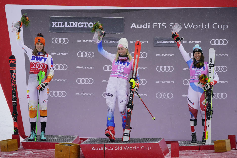 From left, second-place finisher Slovakia's Petra Vlhova, first-place finisher United State's Mikaela Shiffrin and third-place finisher Switzerland's Wendy Holdener celebrate on the podium after a women's World Cup slalom ski race Sunday, Nov. 28, 2021, Killington, Vt. (AP Photo/Robert F. Bukaty)