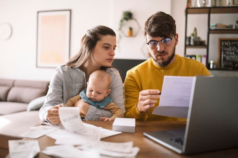 Young couple paying bills