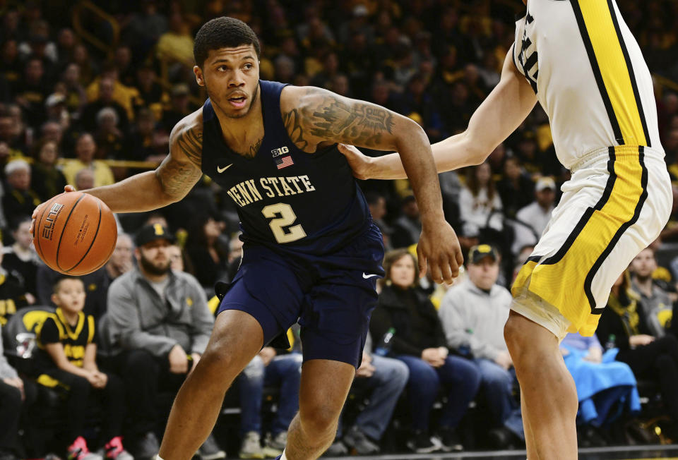 FILE - Penn State's Myles Dread (2) tries to drive past Iowa's Luka Garza during the first half of an NCAA college basketball game in Iowa City, Iowa, in this Saturday, Feb. 29, 2020, file photo. “A lot of kids that are coming from places that don’t have a lot of money, their families aren’t very well off, they’re not going to go to a school where they’re going to have to struggle even more,” Penn State basketball player Myles Dread said. “They’re going to go somewhere where they can help not only support themselves and live comfortably, but help support their family.” Dread said he has tried to lobby Pennsylvania officials to support measures that could help athletes. The state does have pending legislation on the topic but hasn’t passed anything yet. (AP Photo/Cliff Jette, File)