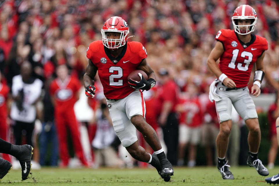 Georgia running back Kendall Milton (2) breaks into the the open field during the first half of an NCAA college football game against the Samford, Saturday, Sept. 10, 2022 in Athens, Ga. (AP Photo/John Bazemore)