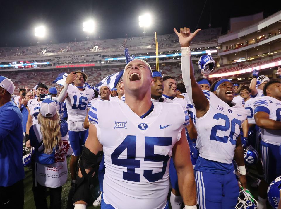 Brigham Young Cougars defensive end Michael Daley (45) celebrates the win over the Arkansas Razorbacks at Razorback Stadium in Fayetteville on Saturday, Sept. 16, 2023. BYU won 38-31. | Jeffrey D. Allred, Deseret News