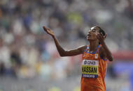 Sifan Hassan of the Netherlands celebrates winning the gold medal in the women's 10,000m final at the World Athletics Championships in Doha, Qatar, Saturday, Sept. 28, 2019. (AP Photo/Petr David Josek)