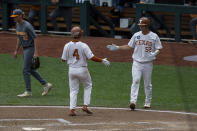 Texas Silas Ardoin (4) scored on a single in the fourth inning against Tennessee during an NCAA college baseball game in the College World Series Tuesday, June 22, 2021, at TD Ameritrade Park in Omaha, Neb. (AP Photo/John Peterson)