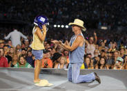 <p>Kenny Chesney shares a sweet moment with a young fan during his weekend tour stop at MetLife Stadium in East Rutherford, New Jersey. </p>