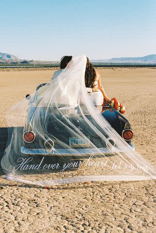 <p>Ashley Marie Myers</p> Candice Huffine and Shelly Lynch-Sparks pose outside after wedding