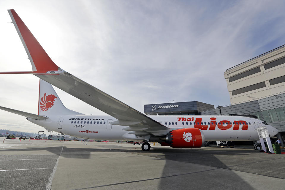 FILE - This March 21, 2018, file photo shows Boeing's first 737 MAX 9 jet at the company's delivery center before a ceremony transferring ownership to Thai Lion Air in Seattle. Boeing didn't tell airline pilots about features of a new flight-control system in its 737 MAX that reportedly is a focus of the investigation into last month's deadly crash in Indonesia, according to pilots who fly the jet in the U.S. (AP Photo/Elaine Thompson)