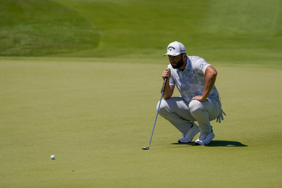 Jon Rahm, of Spain, lines up a putt on the first hole during the third round of the Mexico Open at Vidanta in Puerto Vallarta, Mexico, Saturday, April 30, 2022. (AP Photo/Eduardo Verdugo)