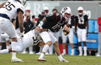 Georgia Tech defensive lineman Kyle Kennard (31) sacks North Carolina State quarterback Bailey Hockman (16) during the first half of an NCAA college football game in Raleigh, N.C., Saturday, Dec. 5, 2020. (Ethan Hyman/The News & Observer via AP, Pool)