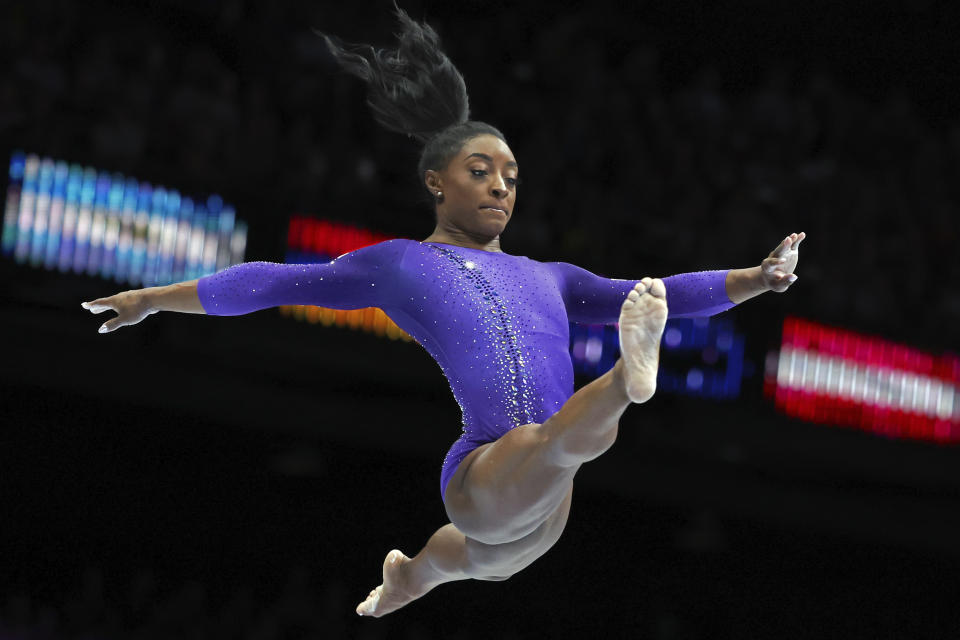 FILE - United States' Simone Biles competes on the beam during the apparatus finals at the Artistic Gymnastics World Championships in Antwerp, Belgium, Sunday, Oct. 8, 2023. Biles was named the AP Female Athlete of the Year for a third time on Friday, Dec. 22, 2023, after winning national and world all-around titles in her return to gymnastics following a two-year break after the Tokyo Olympics. (AP Photo/Geert vanden Wijngaert, File)