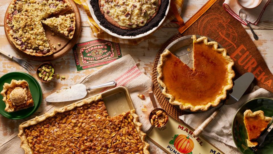 pie assortment including fresh fig tart with pistachio crumble, peanut salted caramel slab pie, and brûléed pumpkin pie