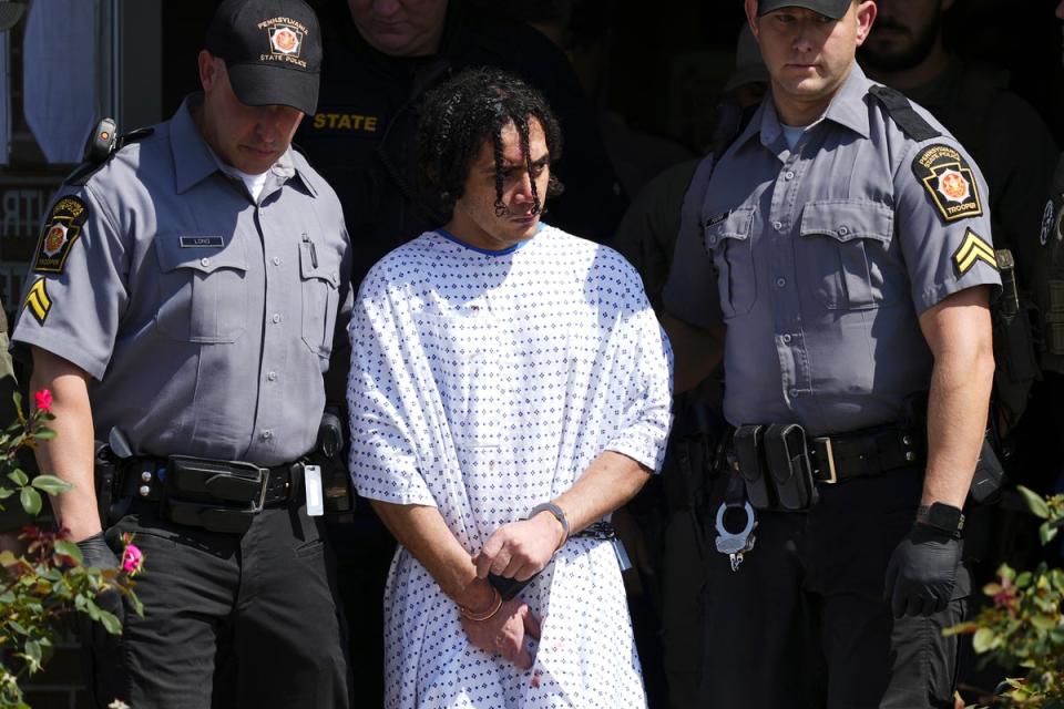 Law enforcement officers escort Danilo Cavalcante from a Pennsylvania State Police barracks in Avondale, Pa (Copyright 2023 The Associated Press. All rights reserved.)