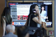 A TV screen shows a report about Denmark's recalling three types of spicy instant noodle products imported from South Korea, during a news program at the Seoul Railway Station in Seoul, South Korea, Thursday, June 13, 2024. Food authorities in Denmark have recalled three types of spicy instant noodle products imported from South Korea over possible risks for "acute poisoning." Consumers are asked to discard them or return the noodles to the retailer. (AP Photo/Lee Jin-man)