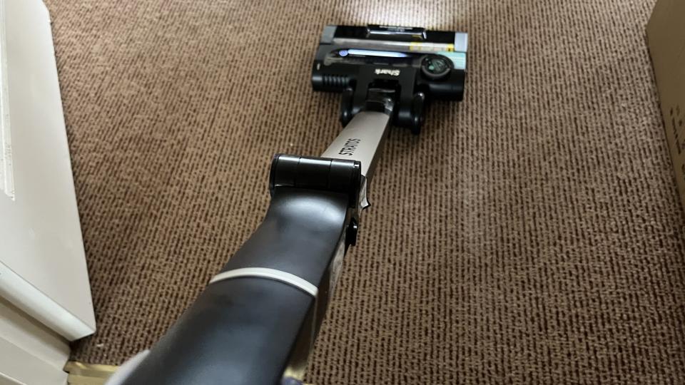 vacuuming sugar on carpet with the shark stratos cordless