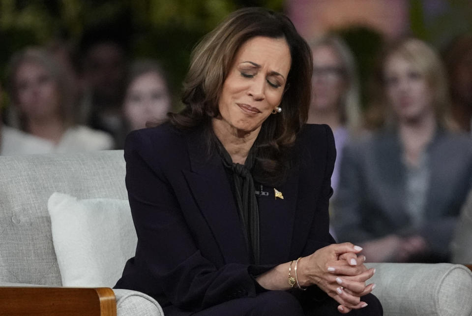 Democratic presidential nominee Vice President Kamala Harris listens to a parent's survivor story as she joins Oprah Winfrey at Oprah's Unite for America Live Streaming event Thursday, Sept. 19, 2024 in Farmington Hills, Mich. (AP Photo/Paul Sancya)