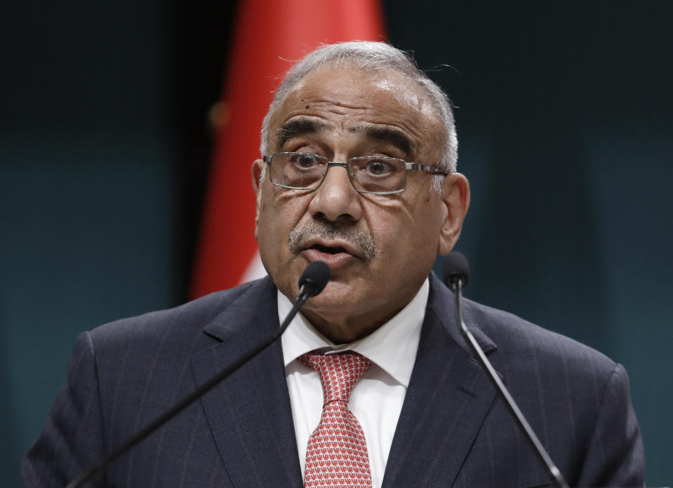 FILE - In this May 15, 2019 file photo, Iraqi Prime Minister Adel Abdul-Mahdi speaks to the media during a joint news conference with Turkish President Recep Tayyip Erdogan, in Ankara, Turkey. Adel Abdul-Mahdi said Friday, Nov. 29, he would submit his resignation to parliament, a day after more than 40 people were killed by security forces and following calls by Iraq's top Shiite cleric for lawmakers to withdraw support. In a statement, Abdul-Mahdi said he "listened with great concern" to al-Sistani's sermon and made his decision in response to his call and in order to "facilitate and hasten its fulfillment as soon as possible."(AP Photo/Burhan Ozbilici, File)