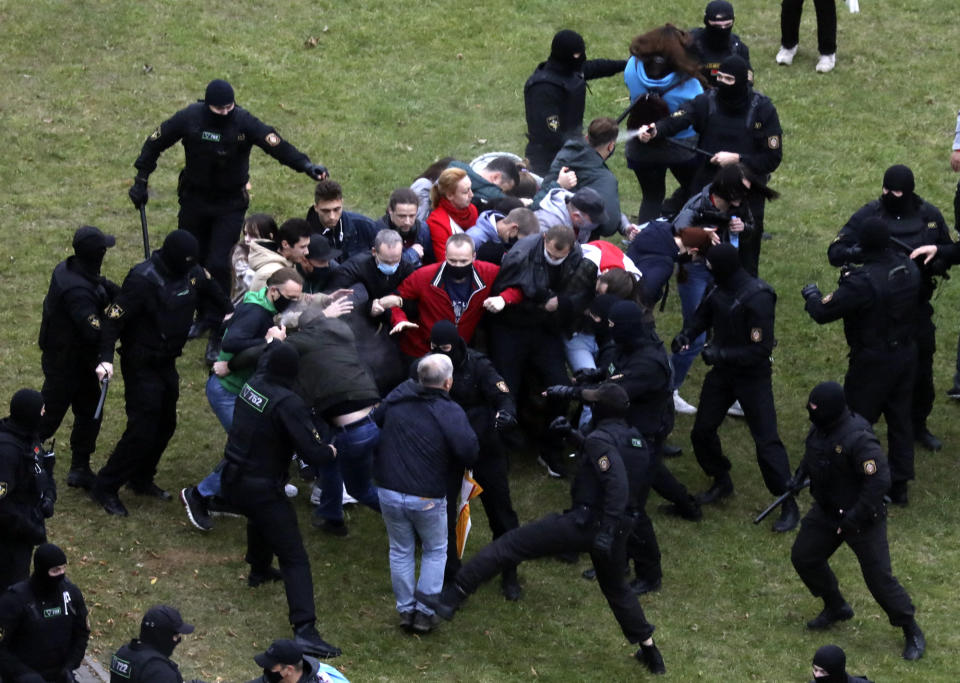 People clash with policemen during an opposition rally to protest the official presidential election results in Minsk, Belarus, Sunday, Oct. 11, 2020. Belarus' authoritarian president Alexander Lukashenko on Saturday visited a prison to talk to opposition activists, who have been jailed for challenging his re-election that was widely seen as manipulated and triggered two months of protests. (AP Photo)