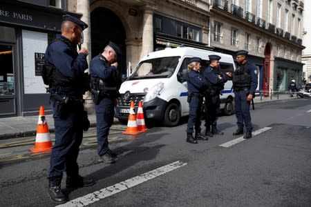 French police block the street where former French President Jacques Chirac was living in Paris