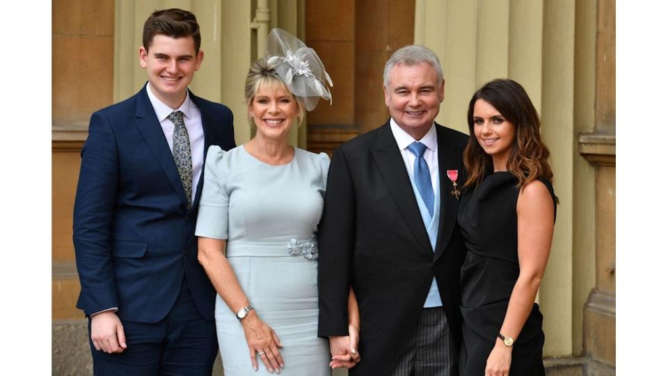 Journalist and broadcaster, Eamonn Holmes, (2R), with his wife Ruth Langsford (2L), his son Jack (L) and daughter Rebecca, poses with his medal after he was appointed Officer of the Order of the British Empire (OBE) for services to broadcasting, by Britain's Queen Elizabeth II during an investiture ceremony at Buckingham Palace in London on June 1, 2018