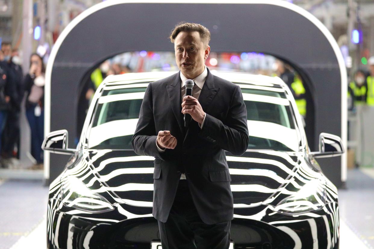 Elon Musk speaks at the opening of a new Tesla factory.